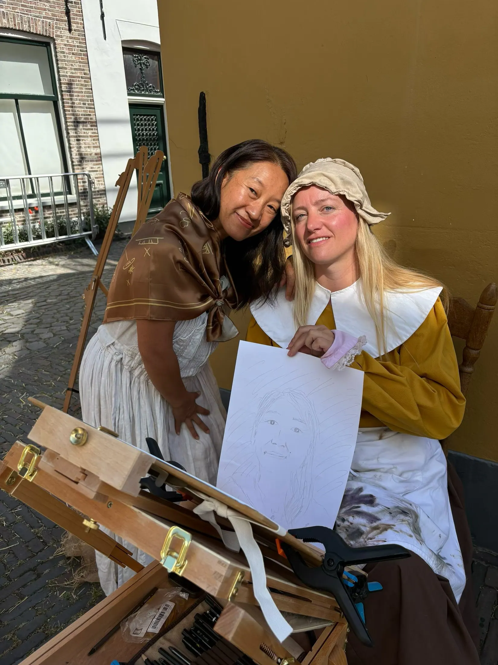 Women gathering around a MING cultural project